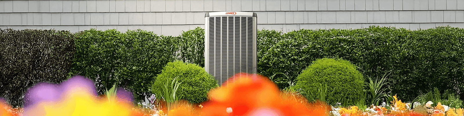 Lennox outdoor heat pump beside a North Vancouver home surrounded by landscaped gardens