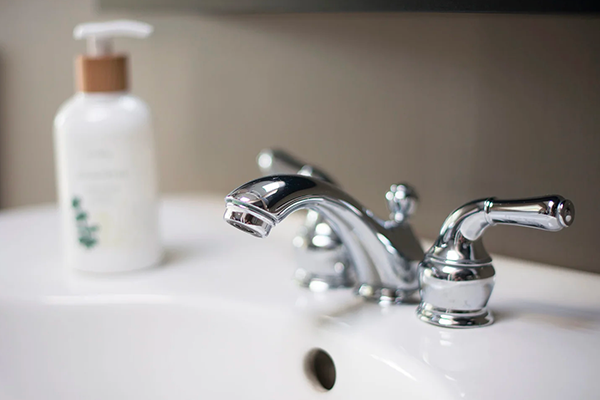 Chrome bathroom faucet installed by a North Shore plumbing professional.